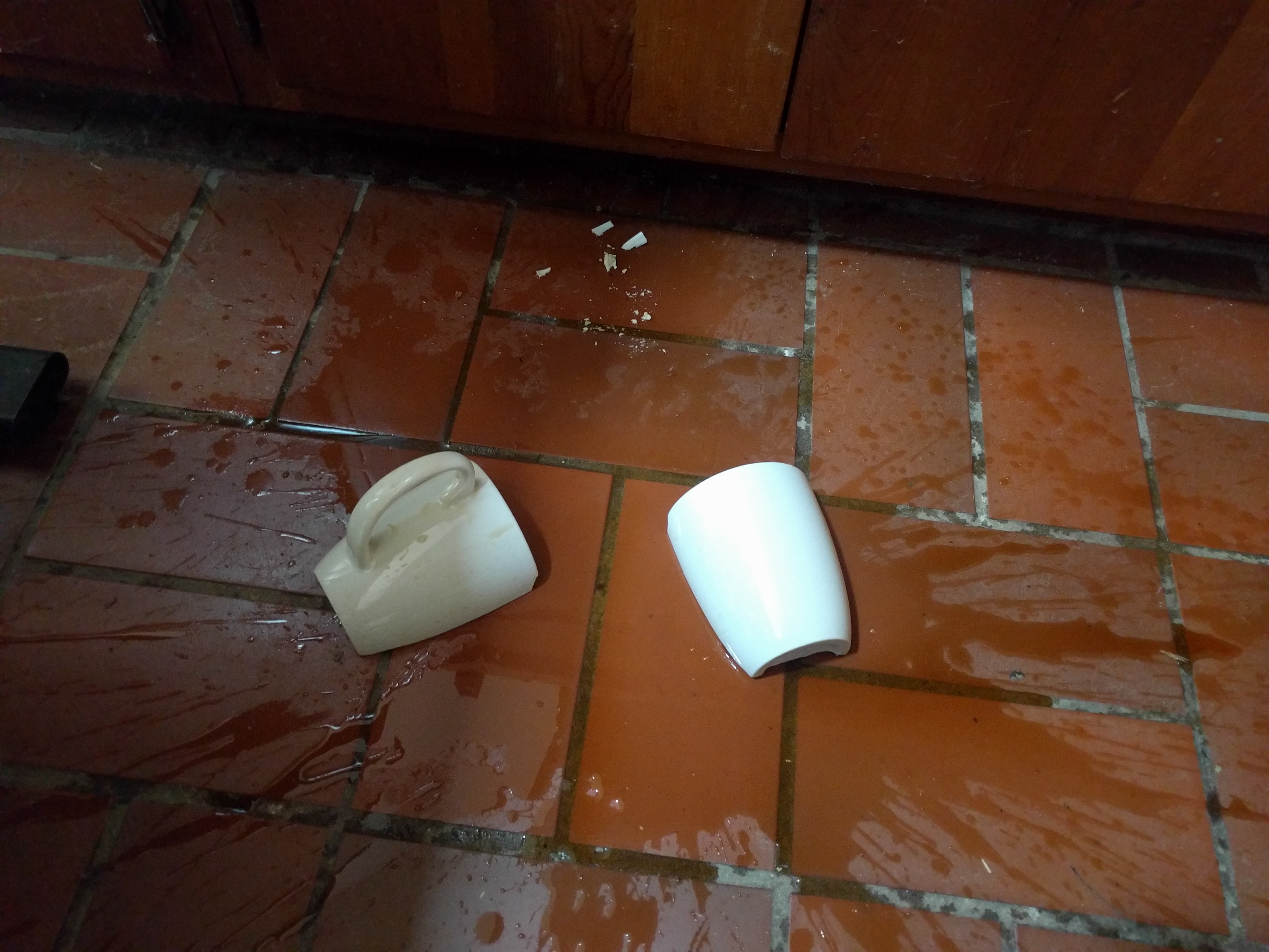 broken cup on floor