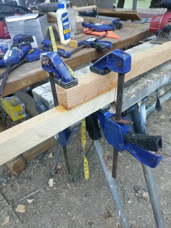 2 pieces of wood held together with clamps