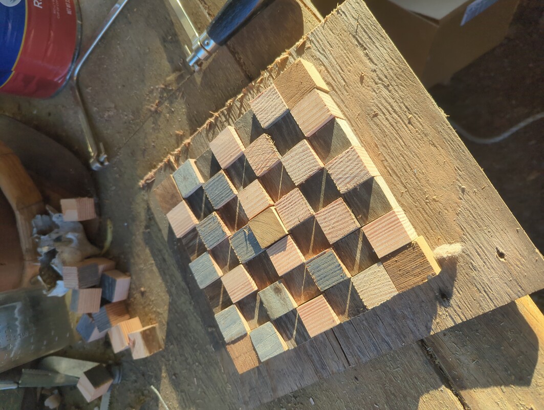 squares of wood laid out in a 7x7 patterh