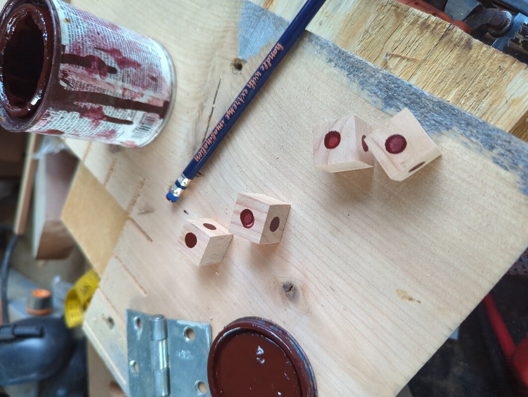 4 cubes with stamps of uneven lumpy wood stain