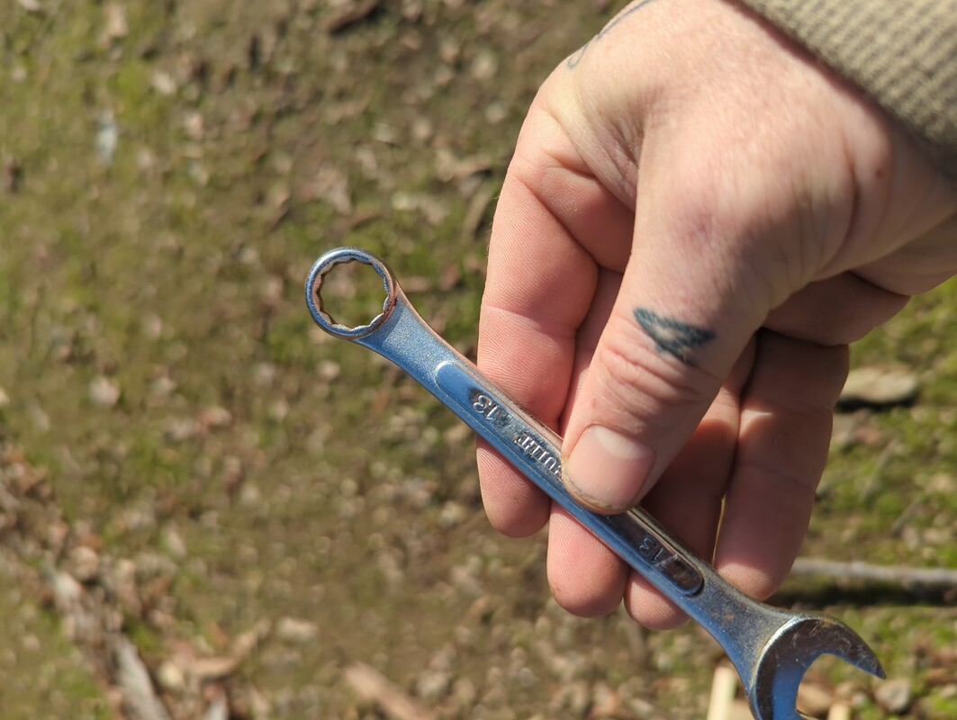 a 13mm wrench in my hand.