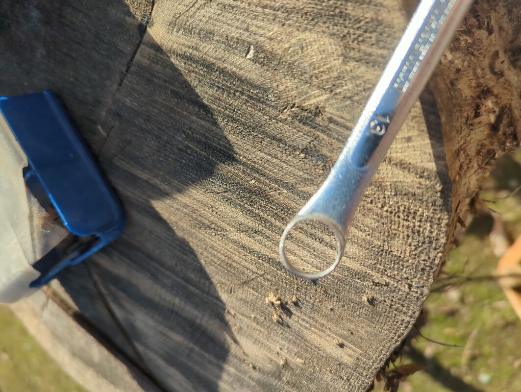 the closed end of the 13mm wrench. The inside has been carved smooth as is a short 13mm cylinder