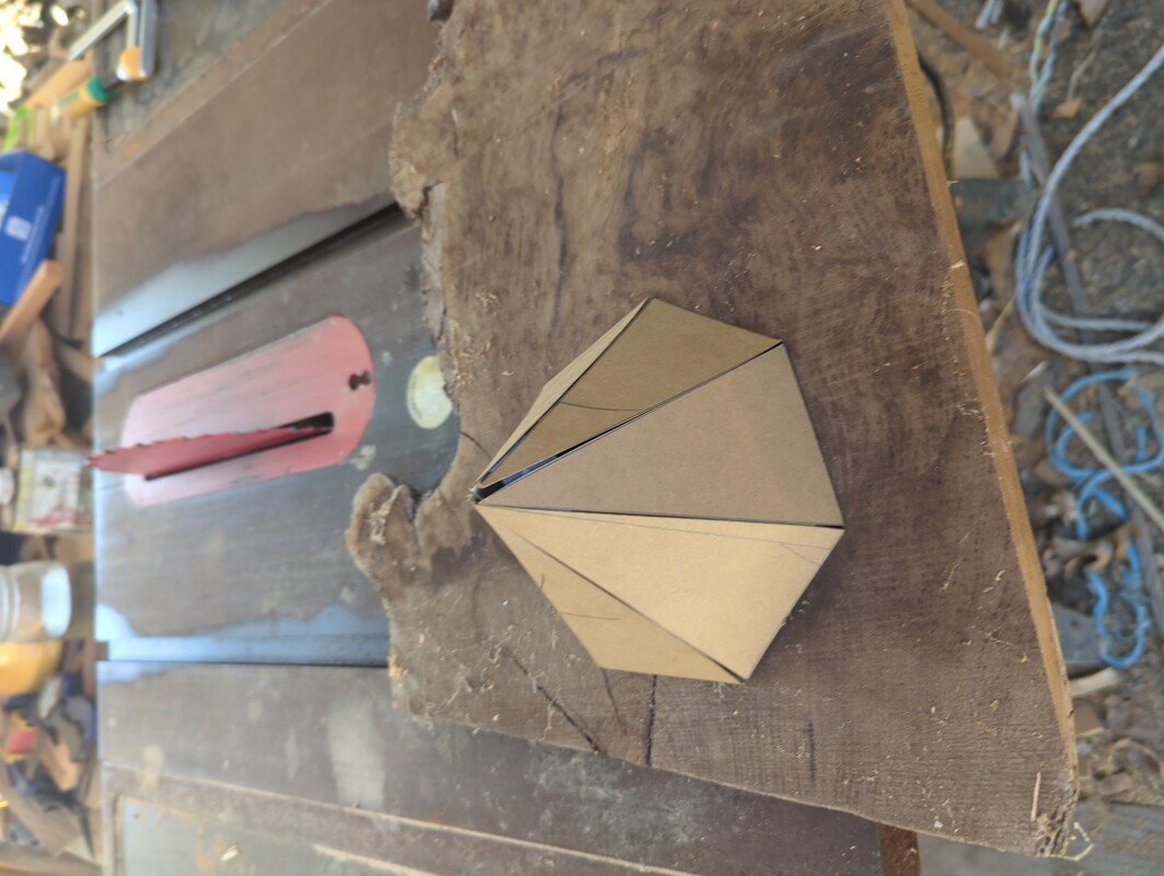 a seven sided pyramid of cardboard