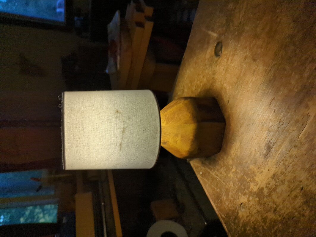 7 sided lamp with a small round lamp shade