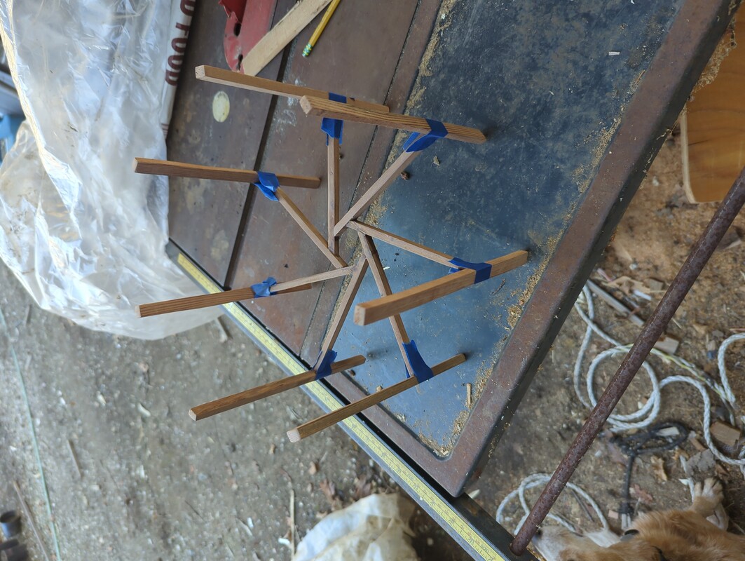 long skinny pieces of wood glued to the ends of the shade base extensions